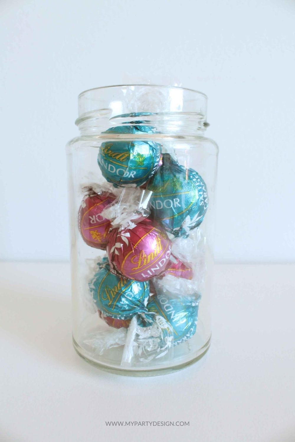 glass jar filled with Lindt Lindor chocolate truffles for diy gift
