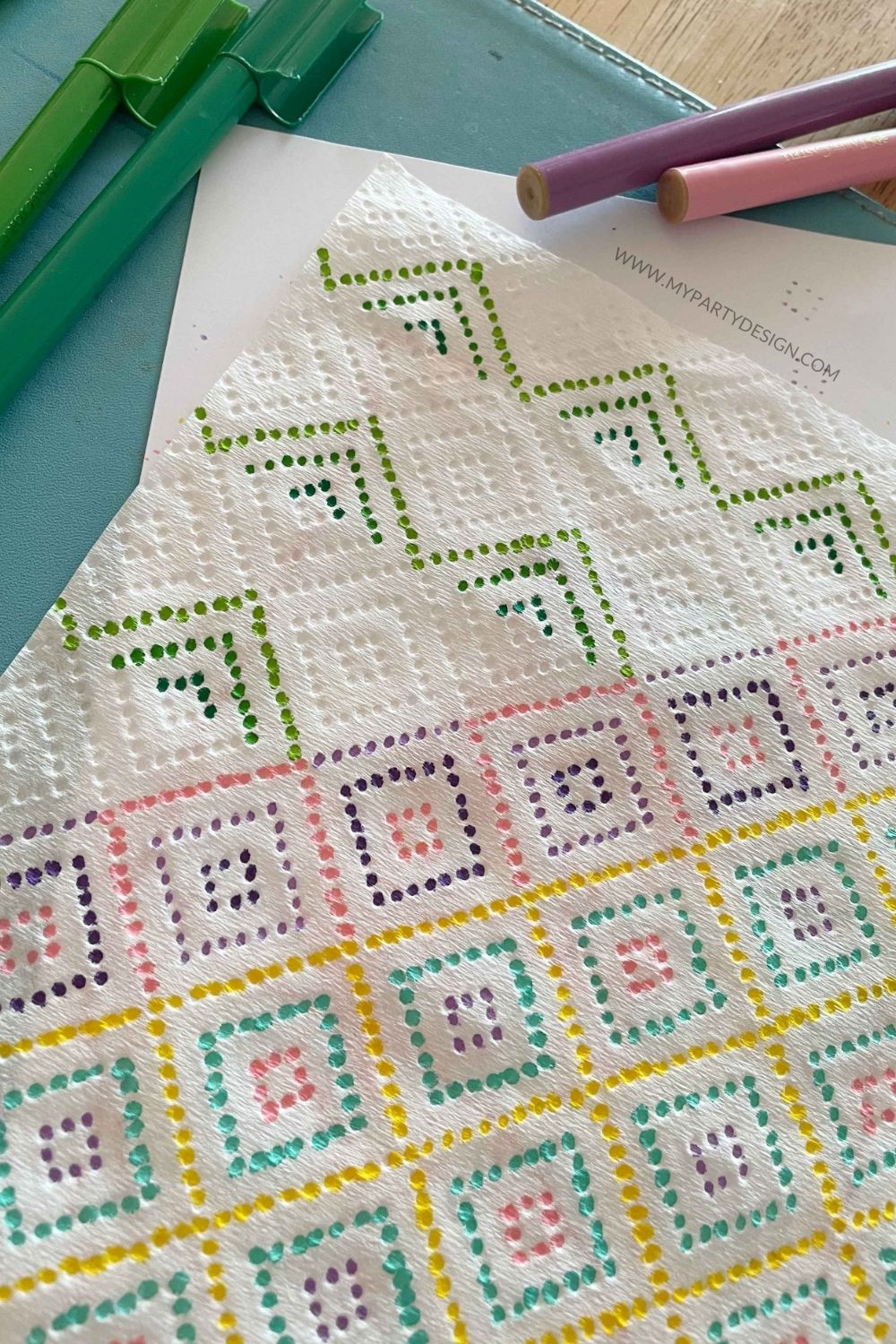 geometric patterns painted on a paper towel