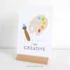 I-AM-AFFIRMATION-CARDS-00C I am affirmation card on a stand that reads "I am creative"