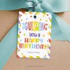 squishing you a happy birthday gift tag in rainbow colors