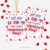 red and pink Valentine's Day gift tags that read "hip hip hooray, have a happy valentine's day"