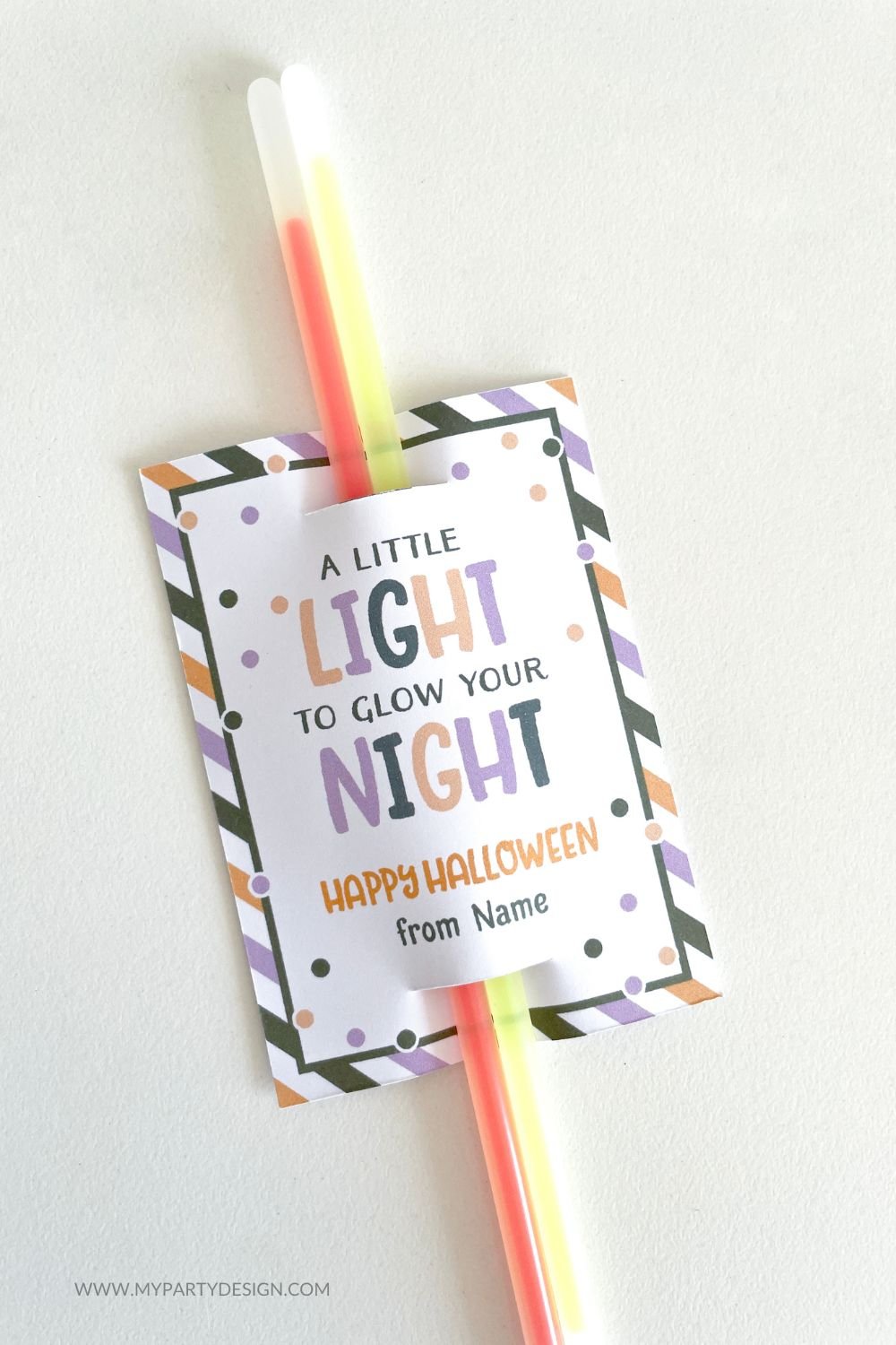halloween glow sticks class gift with tag that reads "a little light to glow your night"